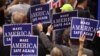 Delegates hold signs during speeches at the Republican National Convention, Cleveland, Ohio, July 18, 2016. 