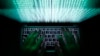 An illustration picture shows a man using a computer keyboard to enter data in Warsaw, Poland.