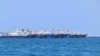 File-Some of the 220 Chinese vessels are seen moored at Whitsun Reef, South China Sea, March 7, 2021. 
