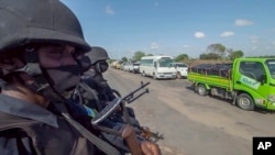 Polisi wa Rwanda wakifanya doria katika mji wa Palma, Jimbo la Cabo Delgado, Msumbiji, Aug. 15, 2021.