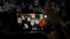 FILE - Activists display photos of journalists who have been killed in Mexico during a protest in Mexico City, July 10, 2023.