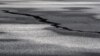 A road is damaged in the village of Grindavik, which was evacuated due to volcanic activity, in Iceland, Nov. 14, 2023. 