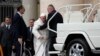 Pope Francis is being helped to get onto his car at the end of a weekly general audience in St. Peter's Square, at the Vatican, March 29, 2023.