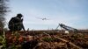 A member of the 15th Separate Artillery Reconnaissance Brigade of the Ukrainian armed forces launches a Shark drone amid Russia's attack on Ukraine, in Kharkiv region, Oct. 30, 2023.