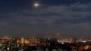 FILE - In this photo released by the Syrian official news agency SANA, shows missiles flying in the sky near Damascus International Airport, in Damascus, Syria, Jan. 21, 2019.