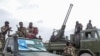 FILE - Somali military force members supporting anti-government opposition leaders gather before leaving to their bases in Mogadishu, Somalia, on May 7, 2021