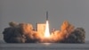 A solid-fuel space rocket is launched during a test flight over the sea near Jeju Island, South Korea, Dec. 4, 2023. (The Defense Ministry/Handout via Reuters)
