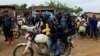 FILE - Congolese police officers secure the streets during a campaign rally of presidential candidate Moise Katumbi in Kitutu village within Mwenga territory of South Kivu province, Democratic Republic of the Congo, Nov. 24, 2023. 