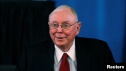 FILE — Berkshire Hathaway Vice Chair Charlie Munger arrives to begin the company's annual meeting in Omaha May 4, 2013. Munger died Nov. 28, 2023, at age 99. 