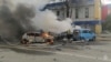 This photo taken from video released by the Russia Emergency Situations Ministry on Dec. 30, 2023, shows firefighters extinguishing flames after shelling in Belgorod, Russia, about 30 kilometers (19 miles) from the border with Ukraine.