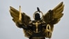 A crow sits on a sculpture of Kyiv's protector Archangel Michael on Independence Square on Nov. 1, 2023. 