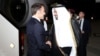 French President Emmanuel Macron shakes the hand of Mohammed bin Abdulaziz bin Saleh al-Khulaifi, the Qatari Minister of State at the Ministry of Foreign Affairs, in Doha, Qatar, Dec. 2, 2023.