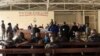 FILE - Members of the Congolese army, sentenced to death for desertion and cowardice when fighting M23 rebels, sit inside a military courtroom during their trial in Goma, North Kivu province, Democratic Republic of Congo, May 3, 2024.