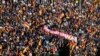 Tens of thousands of people rally around a banner that says "PSOE sells Spain" during a protest against an amnesty bill for those involved with Catalonia's failed 2017 independence bid, in Madrid, Nov. 18, 2023. 