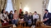 Qatar ambassador to Russia, Sheikh Ahmed bin Nasser al-Thani and Alexey Ghazaryan of the Russian Office of the Commissioner for Children's Rights, meet Ukrainian children and their family members at the Qatari embassy in Moscow, Dec. 5, 2023.