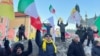 Protesters celebrate the guilty verdict of Hamid Noury in Stockholm, Dec. 19, 2023.