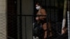 FILE - Bolivia's former interim President Jeanine Anez walks to her sentencing at the Miraflores women's jail, in La Paz, June 15, 2022.