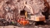 FILE — In this photo released by China's Xinhua News Agency, rescuers search a collapsed open pit coal mine in northern China's Inner Mongolia Autonomous Region, Feb. 23, 2023. An accident at a coal mine in China's Henan Province left at least 10 dead, state media said Saturday. 