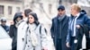 FILE - Namrata Hinduja, left, and Ajay Hinduja, second right, arrive with lawyers for their trial in Geneva, Jan. 15, 2024. A Swiss court on June 21, 2024, acquitted the Hindujas of trafficking but sentenced them to prison for exploiting workers.