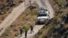 FILE - UN peacekeepers (UNIFIL) seen along the Lebanese side of the border with Israel, seen from Israel, July 6, 2023.