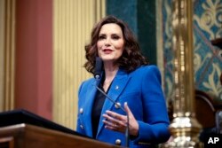 FILE - Michigan Governor Gretchen Whitmer delivers her State of the State address to a joint session of the House and Senate at the state Capitol in Lansing, Michigan, Jan. 25, 2023.