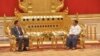 In this photo provided by the Myanmar Military True News Information Team, Senior Gen. Min Aung Hlaing, right, head of the military council, shakes hands with Chinese Foreign Minister Qin Gang, left, during their meeting Tuesday, May 2, 2023, in Naypyitaw, Myanmar.