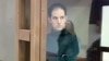 This image provided by the Moscow City Court on Dec. 14, 2023, shows US journalist Evan Gershkovich standing inside a defendants' cage during a court hearing in Moscow.