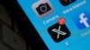 FILE - The X logo is seen on a smartphone screen in Los Angeles, California, on July 31, 2023.