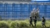 Soldiers patrol outside prison in Cotopaxi, Ecuador, Jan. 14, 2024.