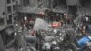 Palestinians inspect the damage of destroyed buildings following Israeli airstrikes on Gaza City, Oct. 27, 2023.