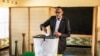 FILE - Incumbent Rwandan President Paul Kagame casts his vote in Kigali, on Aug. 4, 2017. Rwanda will hold presidential and parliamentary polls on July 15 next year, the election commission said on Dec. 12, 2023.