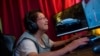María Elena Arévalo, 81, plays Free Fire, a popular online video game, at home at her home in Llay-Llay, Valparaiso Region, Chile, on Dec. 19, 2023. 