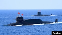 FILE - A nuclear-powered Type 094A Jin-class ballistic missile submarine of the Chinese People's Liberation Army (PLA) Navy is seen during a military display in the South China Sea, April 12, 2018. 