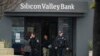 Santa Clara Police officers exit Silicon Valley Bank in Santa Clara, California, March 10, 2023.