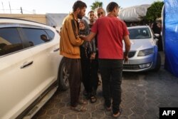 Palestinians mourns the death of their relatives in an Israeli strike, at the Al-Aqsa Martyrs Hospital in Deir al-Balah in the central Gaza Strip on June 2, 2024.