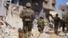 This handout picture released by the Israeli army on May 18, 2024, shows Israeli soldiers during military operations in the Gaza Strip.