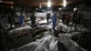 Bodies of Palestinians killed by an explosion at the Al-Ahli Arab hospital are seen gathered at Al-Shifa hospital, in Gaza City, central Gaza Strip, Oct. 17, 2023.