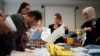 Election officials count ballots at a polling station in Istanbul, Turkey, March 31, 2024. 
