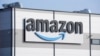 FILE - An Amazon company logo is seen on the facade of a company's building in Schoenefeld near Berlin, Germany, on March 18, 2022. Multinational companies including Amazon, Marriott and Hilton pledged June 19, 2023 to hire more than 13,000 refugees.