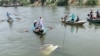 Rescuers work to pull a sunken minibus from a canal of the Nile River near Abu Ghaleb village in Egypt's Giza governorate on May 21, 2024. 