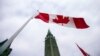 FILE - A Canadian flag flies in front of the peace tower on Parliament Hill in Ottawa, Canada on Dec. 4, 2015.