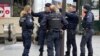 Police stand outside the Bibliotheque Francois-Mitterrand train station, where officers shot and injured a woman after she shouted 'Allahu Akbar' and 'You're all going to die,' in Paris, France, on Oct. 31, 2023.