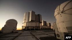 FILE - This picture shows the platform of the Very Large Telescope, with its four optical telescopes and four movable auxiliary telescopes, at the European Southern Observatory's Paranal Observatory in Chile's Antofagasta Region, June 20, 2022.