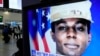 FILE - A TV screen shows a file image of American soldier Travis King during a news program at the Seoul Railway Station in Seoul, South Korea, Sept. 27, 2023. 