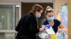 Nurses care for newborns at the University of Vermont Children’s Hospital in Burlington, Vermont, April 28, 2023. Research found that babies born to opioid users had shorter hospital stays when their care emphasized parent involvement.