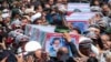 Flag-draped coffins of President Ebrahim Raisi and his companions who were killed in a helicopter crash on Sunday are carried during their funeral in Mashhad, Iran, May 23, 2024. 