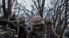 [FILE] A Ukrainian soldier prepares ammunition to fire at Russian front-line positions near Bakhmut, in Ukraine's Donetsk region, March 11, 2023.