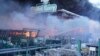 Firefighters put out a fire after two guided bombs hit a large construction supplies store in Kharkiv, Ukraine, May 25, 2024. 