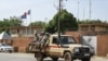 A patrol of the Niger national Police drives past the French Embassy in Niamey, Aug. 28, 2023.