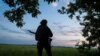A Ukrainian serviceman of the 92nd separate assault brigade guards an area near the town of Vovchansk in Kharkiv region, Ukraine, May 19, 2024.